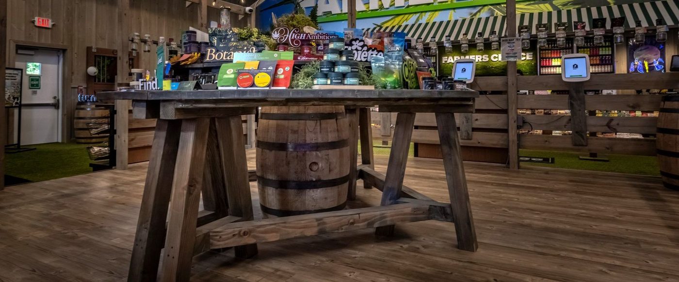 Interior of Farmers Choice dispensary with wooden display table and products